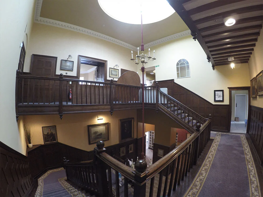 The original grand staircase and panelled gallery at Wallsend Hall